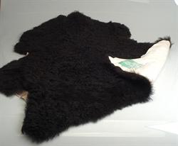 Isländska lamm skinn i svart kort hår